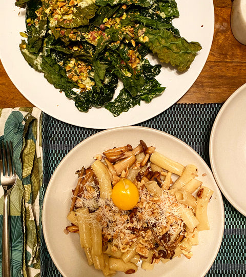 Pasta with Brown Buttered Mushrooms, Buckwheat, and Egg Yolk alongside Raw and Roasted Kale with Pistachios and Creamy Pecorino